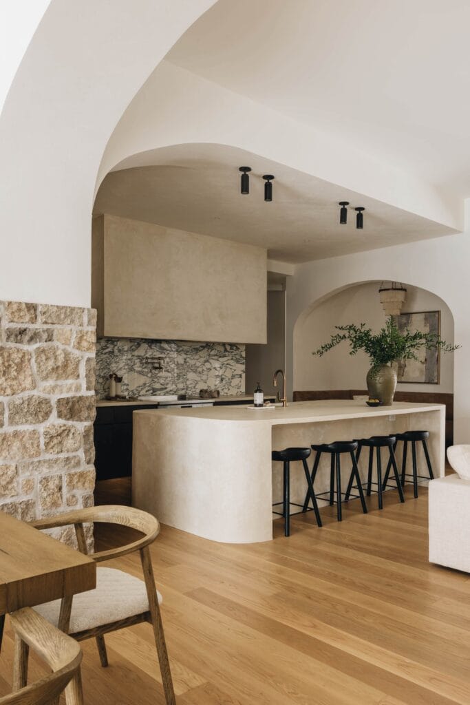 Stone look plaster hood beside a natural stone feature wall, Toronto