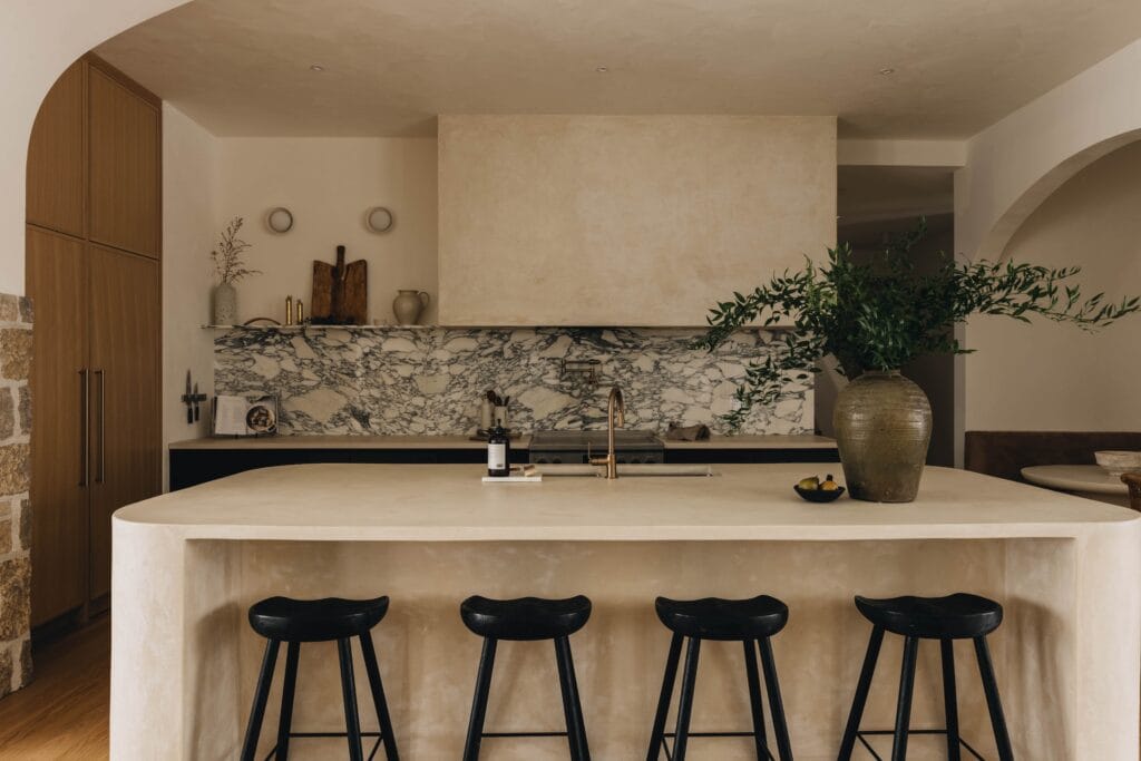 Plastered kitchen island and range hood in a stone look finish, Toronto