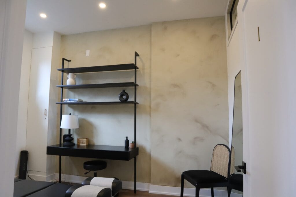 Seamless grey concrete look wall with open shelving, Toronto