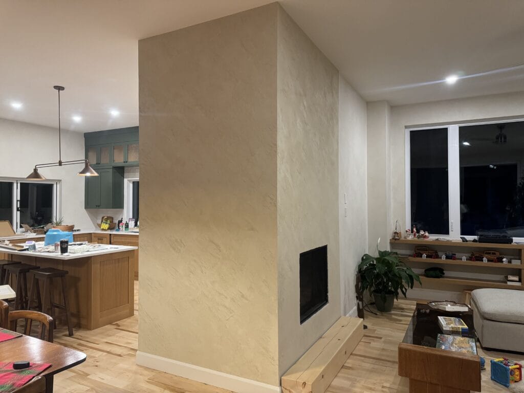 Stone look plaster fireplace column in a Toronto living room