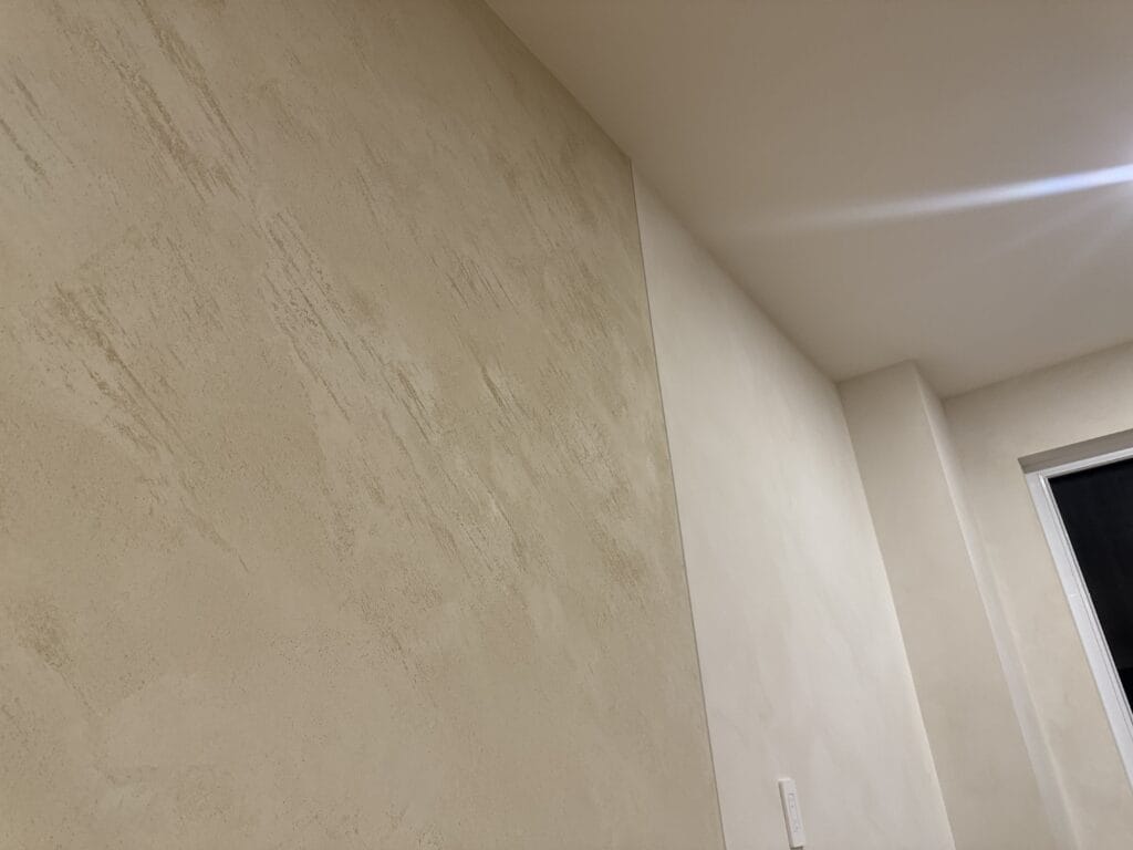 Textured stone look plaster wall in a Toronto home